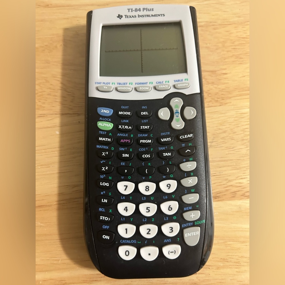 Texas Instruments TI-84 Plus Graphing Calculator Does not include batteries